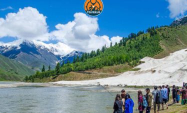 Group of travelers enjoying scenic views in Naran Valley