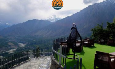 Couple watching sunrise from Eagle’s Nest viewpoint in Hunza