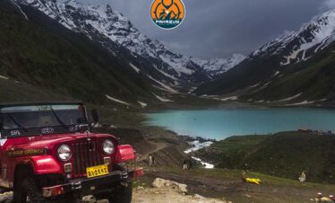 Jeep winding through mountain pass at Babusar Top, Naran