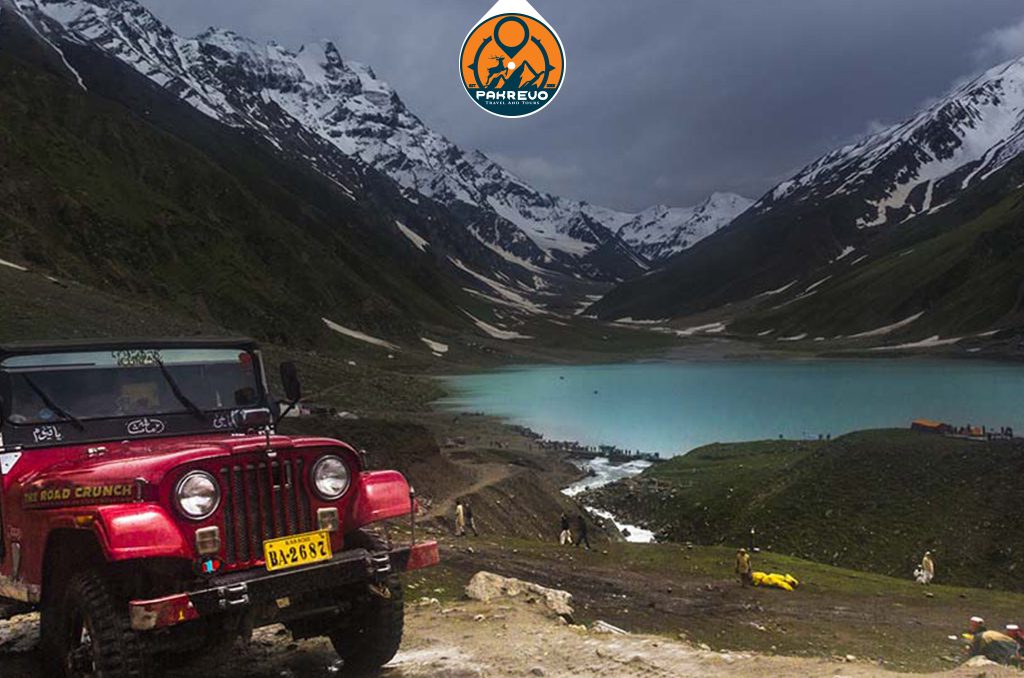 Jeep winding through mountain pass at Babusar Top, Naran