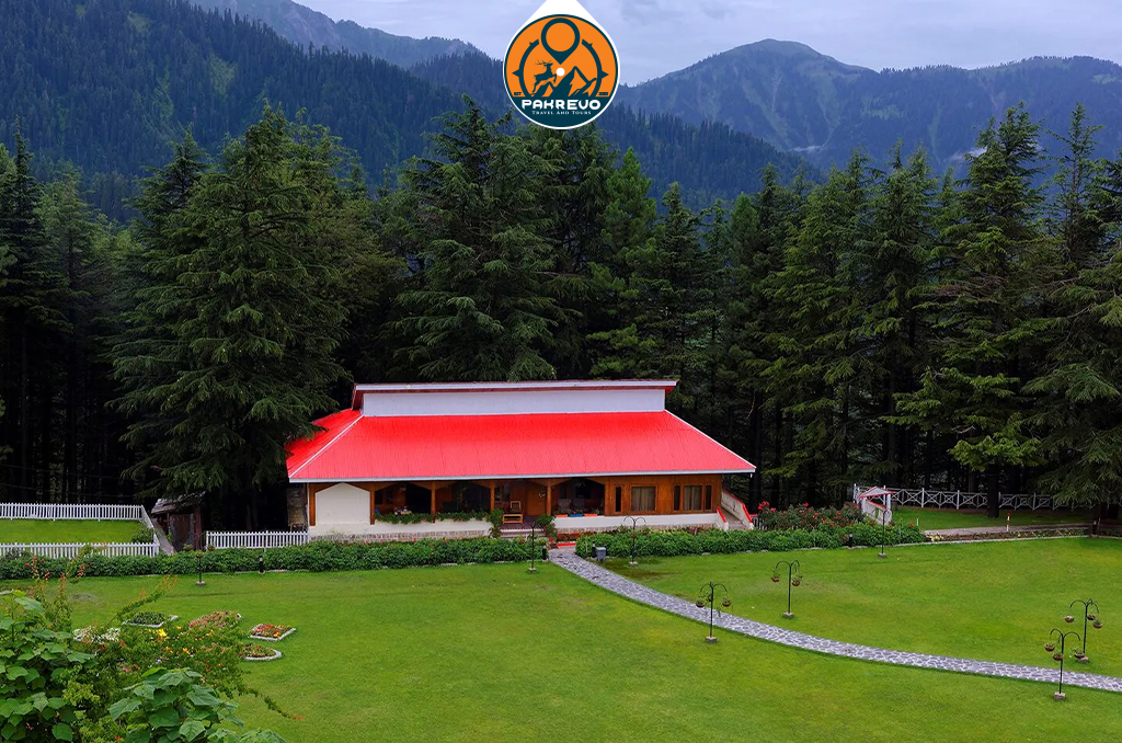 Local village life near Shogran with wooden cottages and lush surroundings