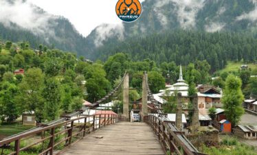 Students crossing a wooden suspension bridge in Neelum Valley