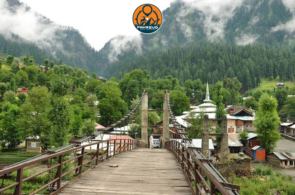 Students crossing a wooden suspension bridge in Neelum Valley