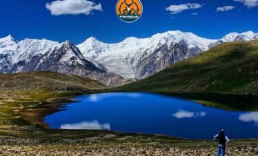 Young trekkers crossing alpine meadows en route to Rush Lake