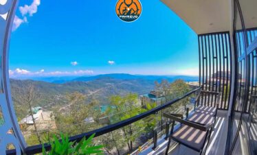 Family enjoying the valley view from the hotel balcony in Murree