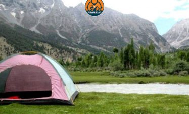 Colorful camping tents in scenic Siran Valley clearing
