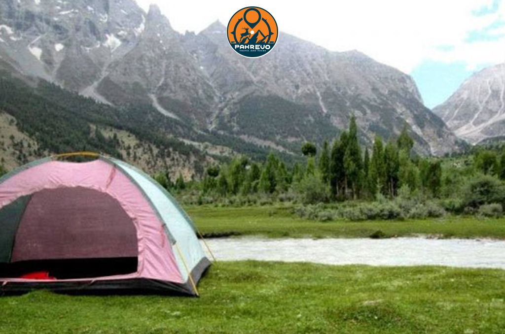 Colorful camping tents in scenic Siran Valley clearing