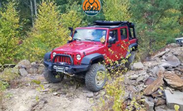 Tourist jeep navigating scenic dirt road in Siran Valley